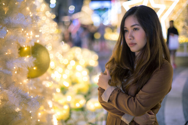 a woman seems to be struggling with mental health during the holidays