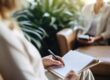 a woman takes notes on how to prepare for residential psychiatric care