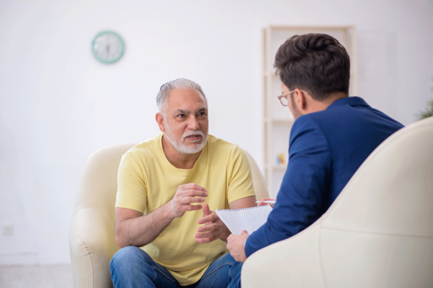 a man starts to open up and heal in therapy