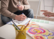 an art therapy participant works on a creative project