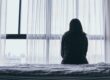 a woman struggles alone with symptoms of schizoaffective disorder