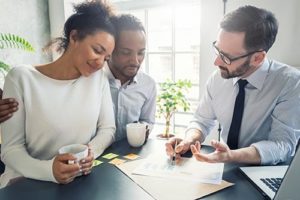 a couple goes over what their insurance covers for mental health treatment with a coverage specialist 